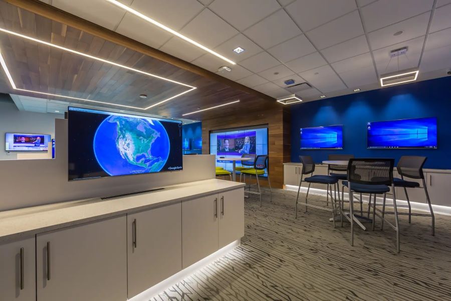 A room with several digital displays and a video wall.
