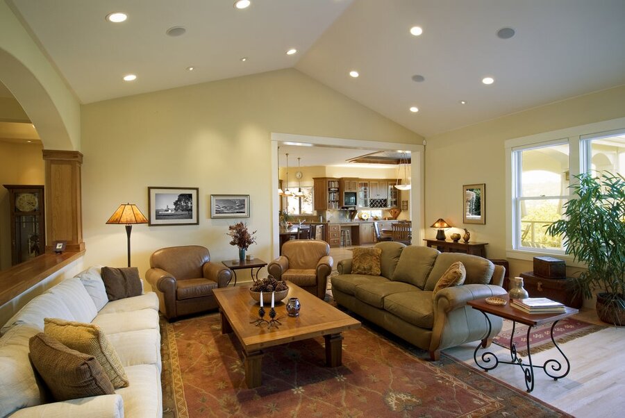 an open living space family room with in-ceiling whole-home audio speakers and lighting fixtures